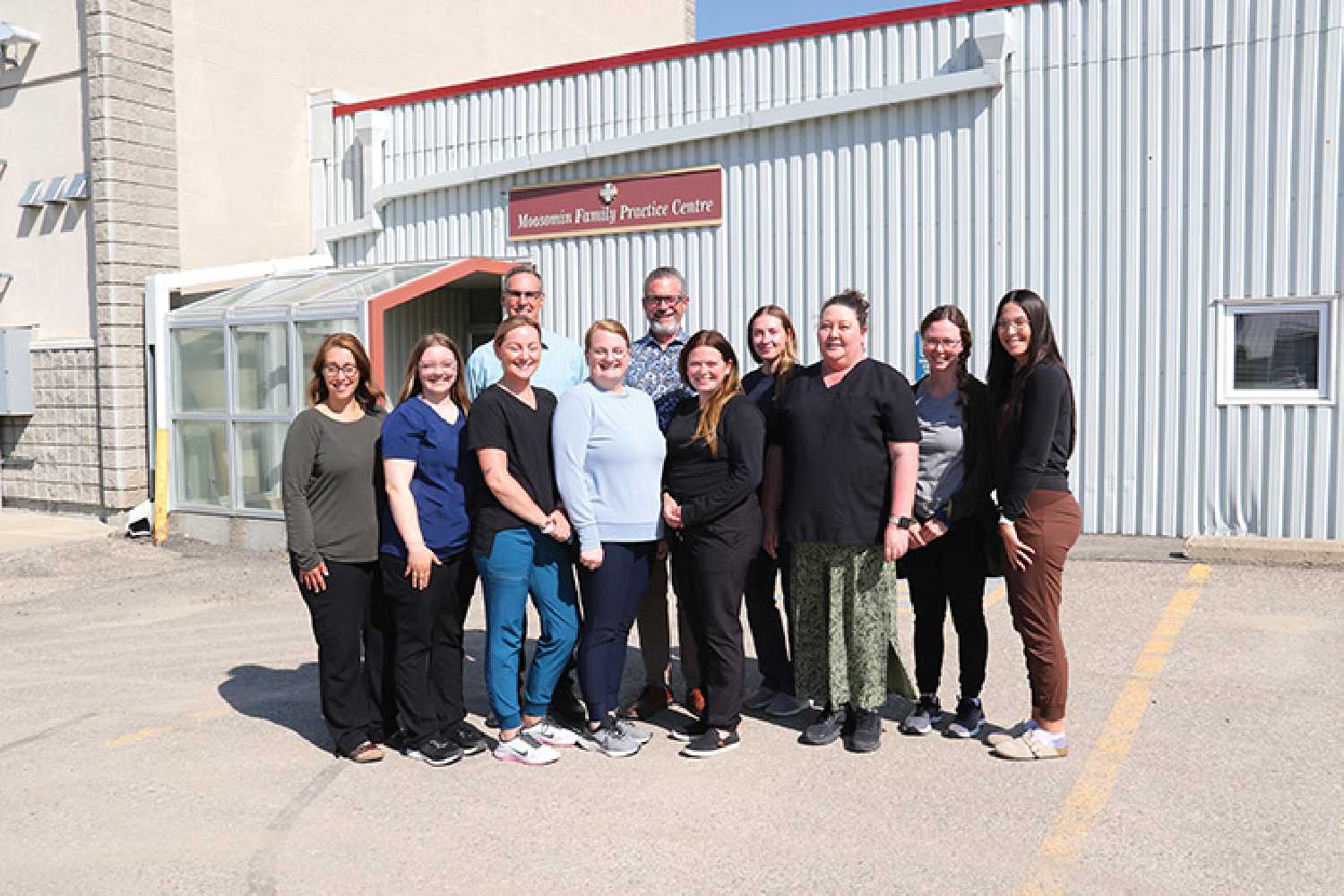 Dr. Kerhoff and Dr. van der Merwe with staff in front of the Family Practice Centre.